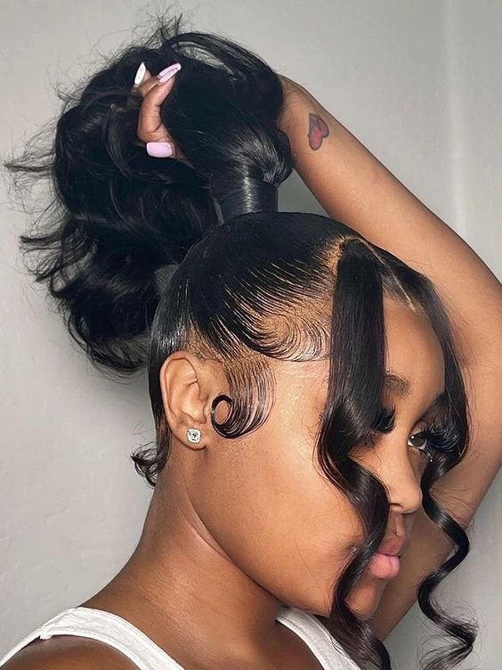 Lady shows off her ponytail with tendrils 