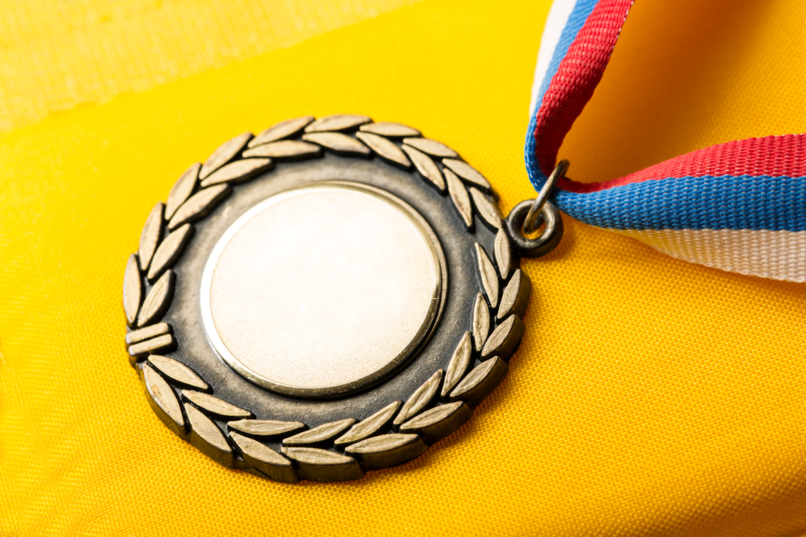 An insert medal without its insert or sticker.