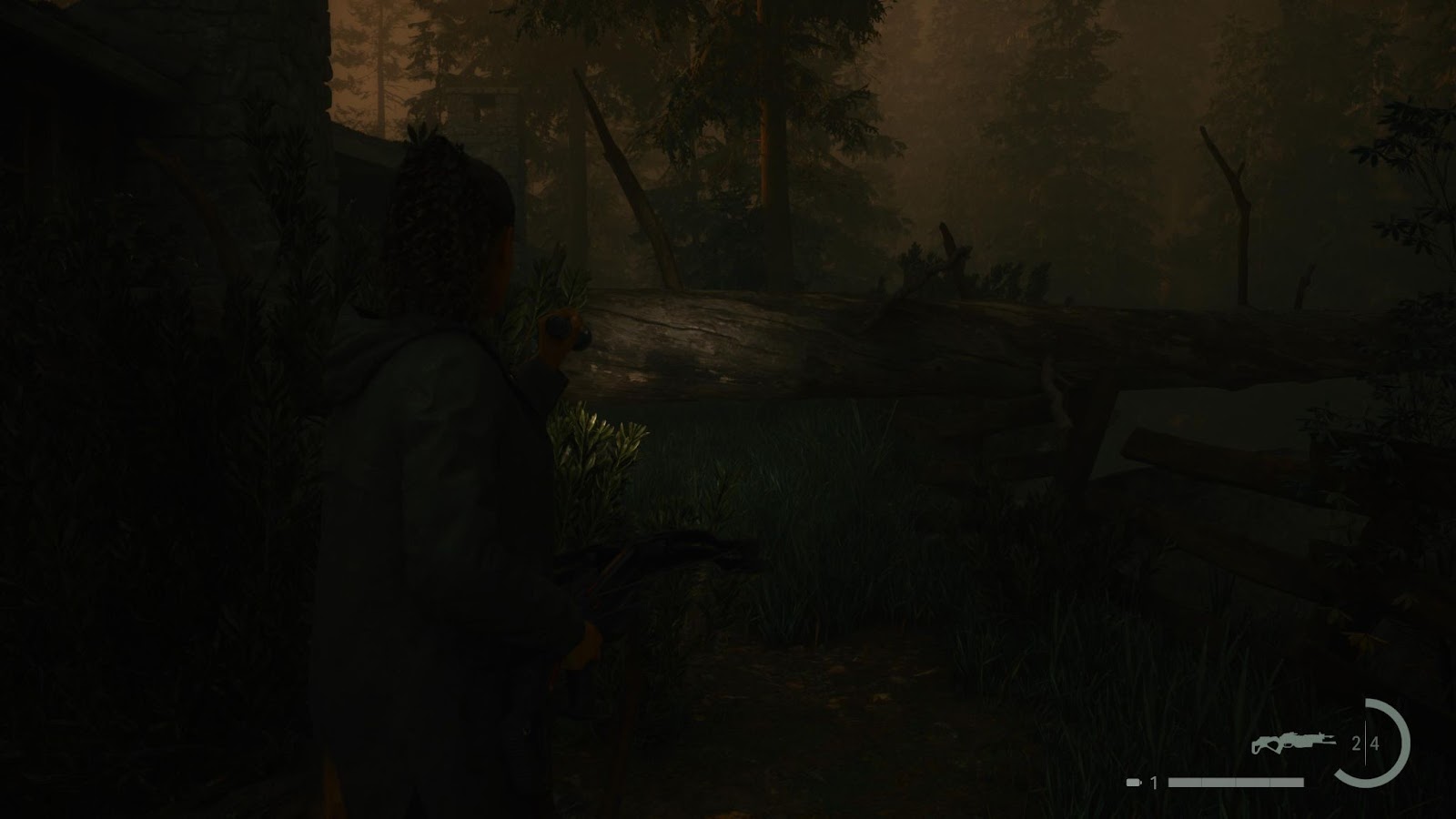 An in game screenshot of the fallen tree in the rental cabins area in Cauldron Lake from Alan Wake 2