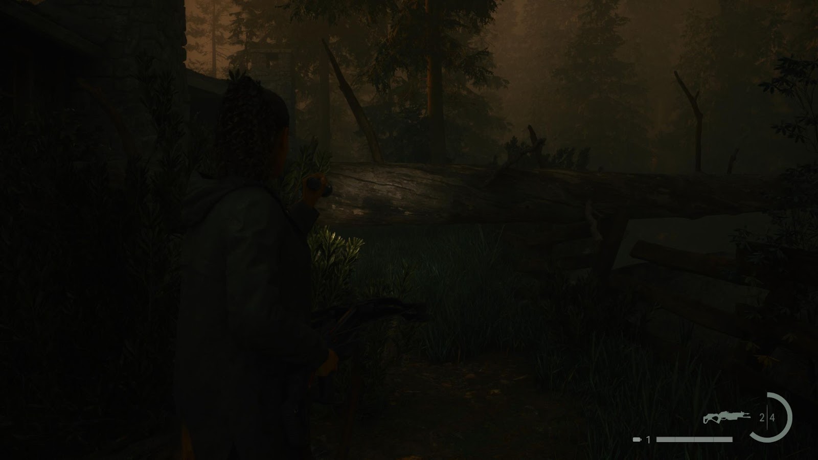 An in game screenshot of the fallen tree in the rental cabins area in Cauldron Lake from Alan Wake 2