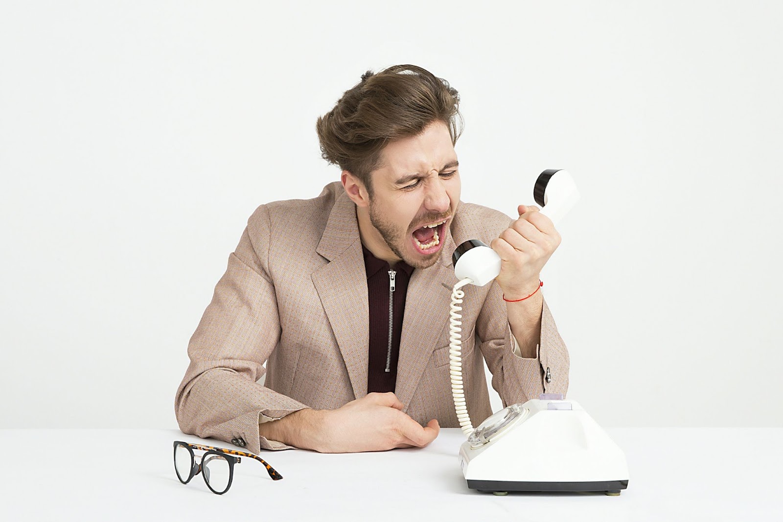A stressful man because a scam debt collector call