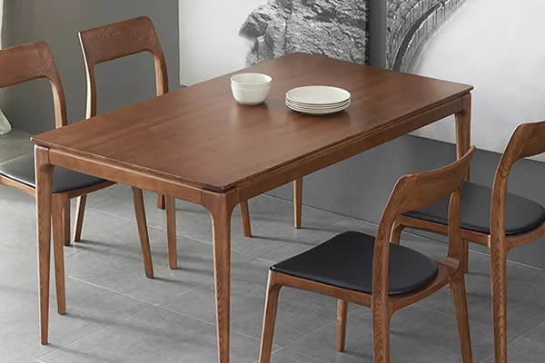 Wooden dining table with tapered legs