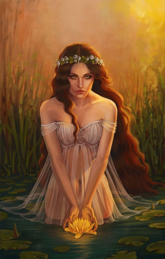 The attire Harmonia wears in the depicted image is a translucent dress that complements her waist-length dark hair. She is standing in a river, cupping a glowing lotus in her hands.