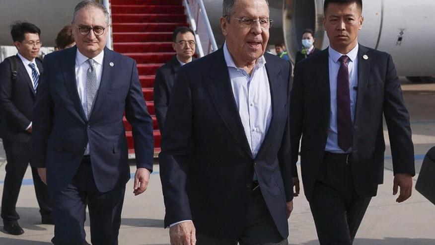 In this photo released by Russian Foreign Ministry Press Service on Monday, April 8, 2024, Russian Foreign Minister Sergey Lavrov, center, walks from the plane upon his arrival in Beijing, China. Russ