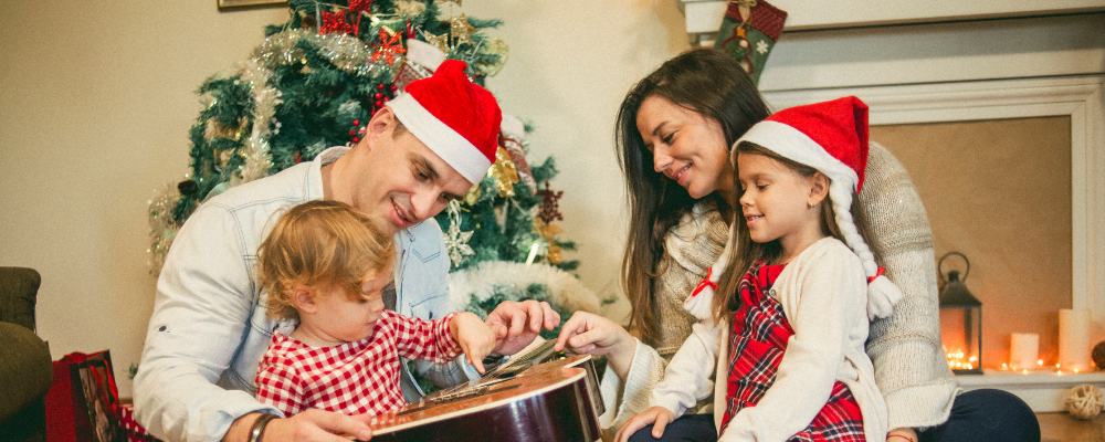 A family enjoying the Christmas break in their living room