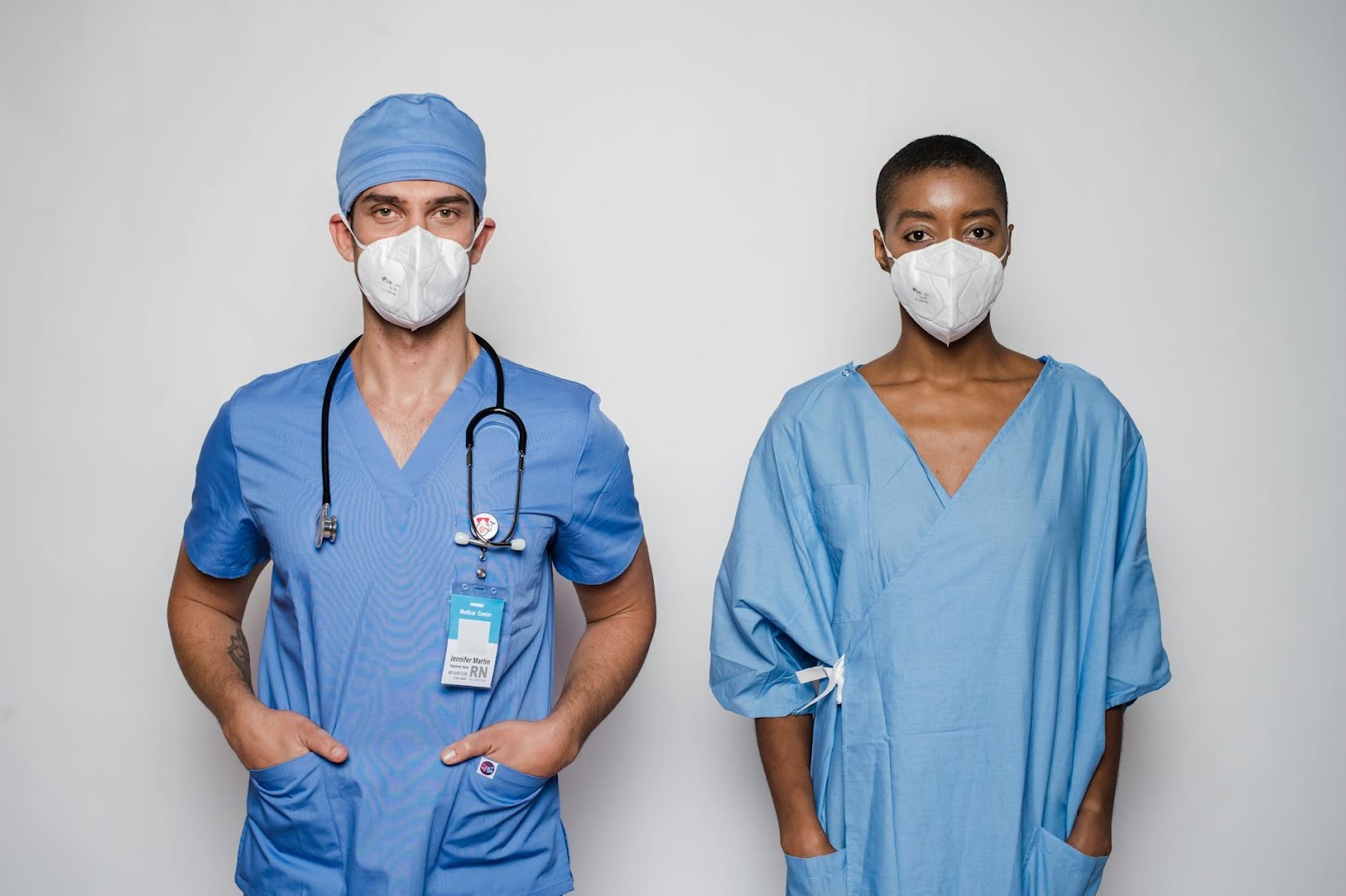 Multiracial doctor and patient in uniform and masks