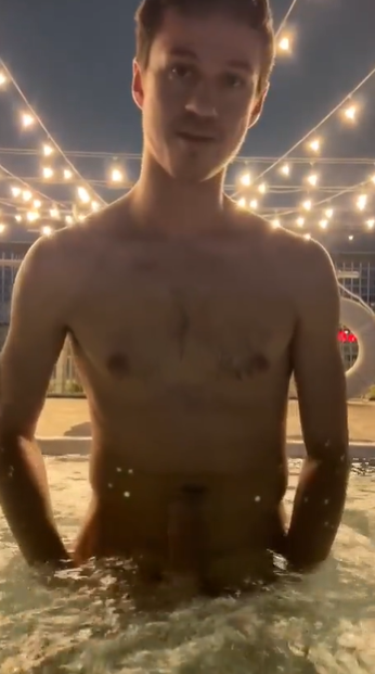 Dakota Wonders naked holding his cock for a night picture in the rooftop hot tub