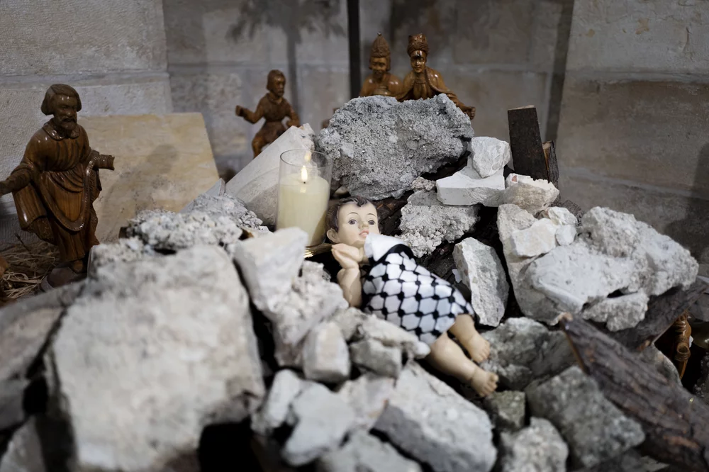 Image of a manger scnee in rubble. Image of a manger scnee in rubble.
