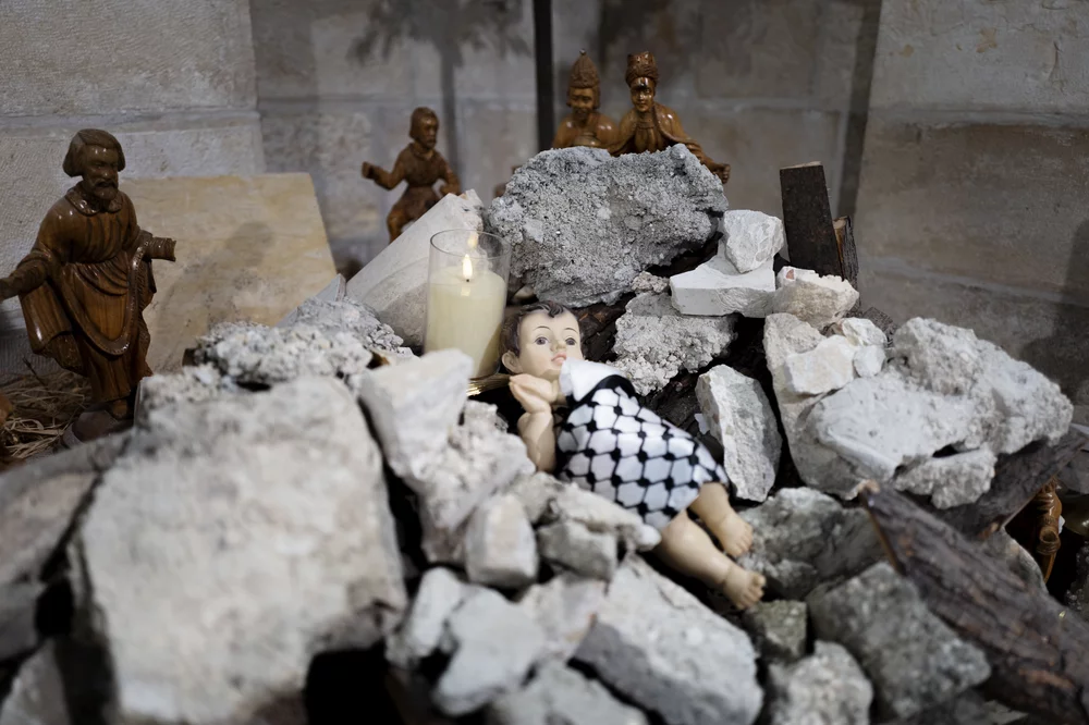 Image of a manger scnee in rubble.