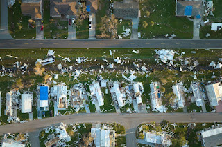 aerial view of hurricane damage in a housing development.