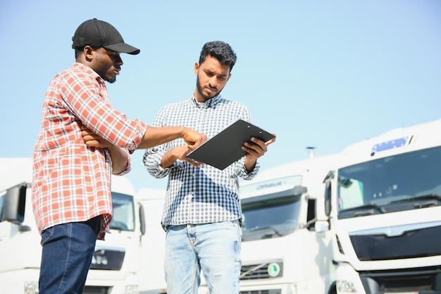 Logistics manager controlling truck driver schedule