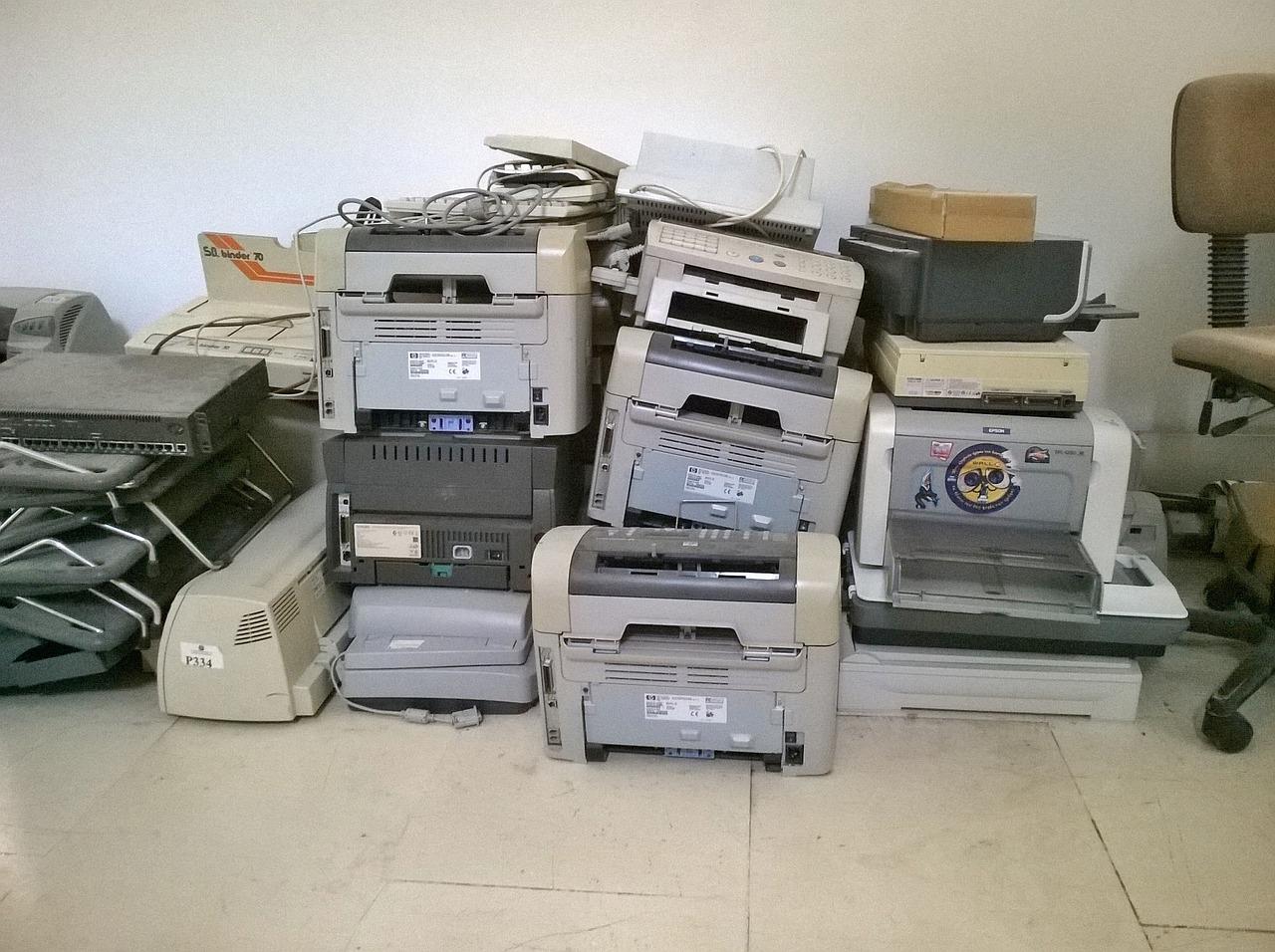 Bunch of old printers in a storage