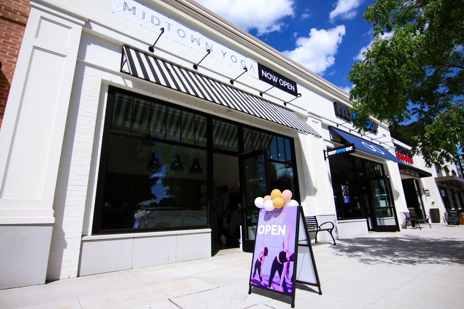 Storefront and signage for Midtown Yoga's grand opening