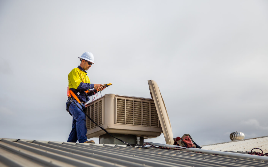 A professional technician conducting an evaporative and repair and maintenance
