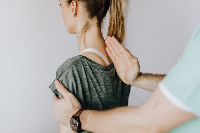 a chiropractor treating patient