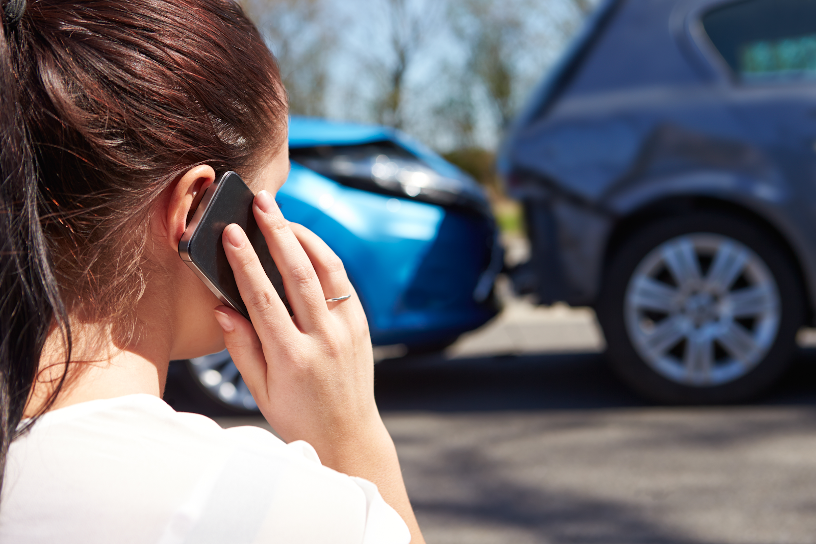 woman calls state farm auto insurance following a car accident