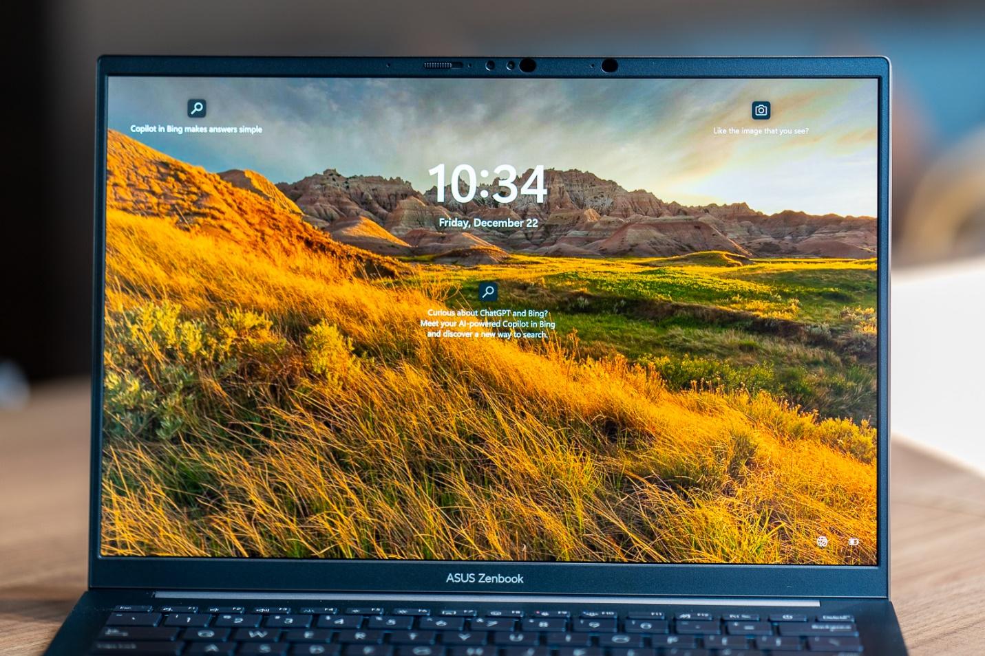 A computer with a landscape on the screen

Description automatically generated