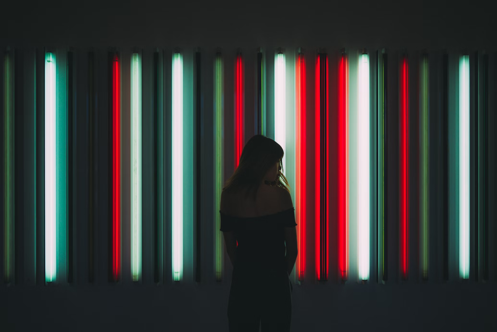 Woman standing in front of light installation.