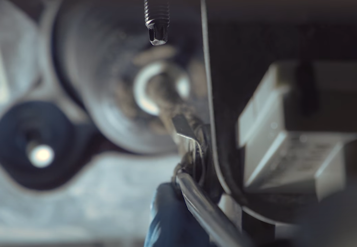 Detach the retaining clip that attaches the brake pedal to the push rod