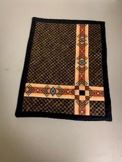 A brown and black place mat

Description automatically generated