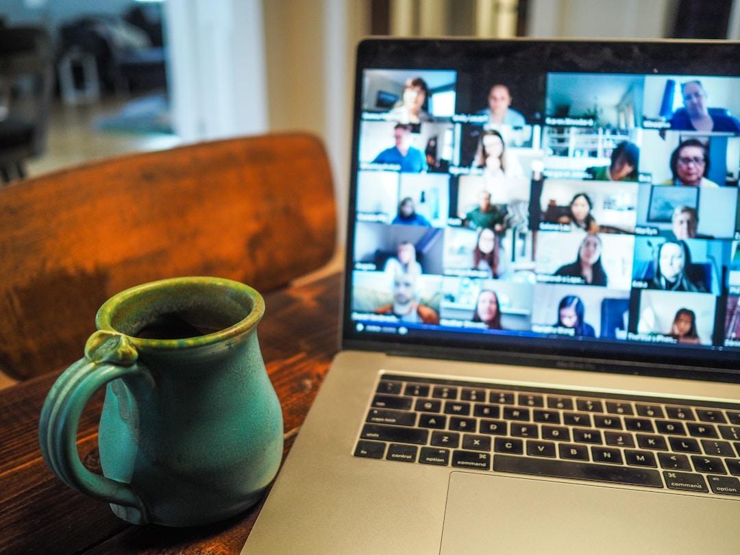 A laptop showing a team video chat where they discuss how do you identify revenue leakage.