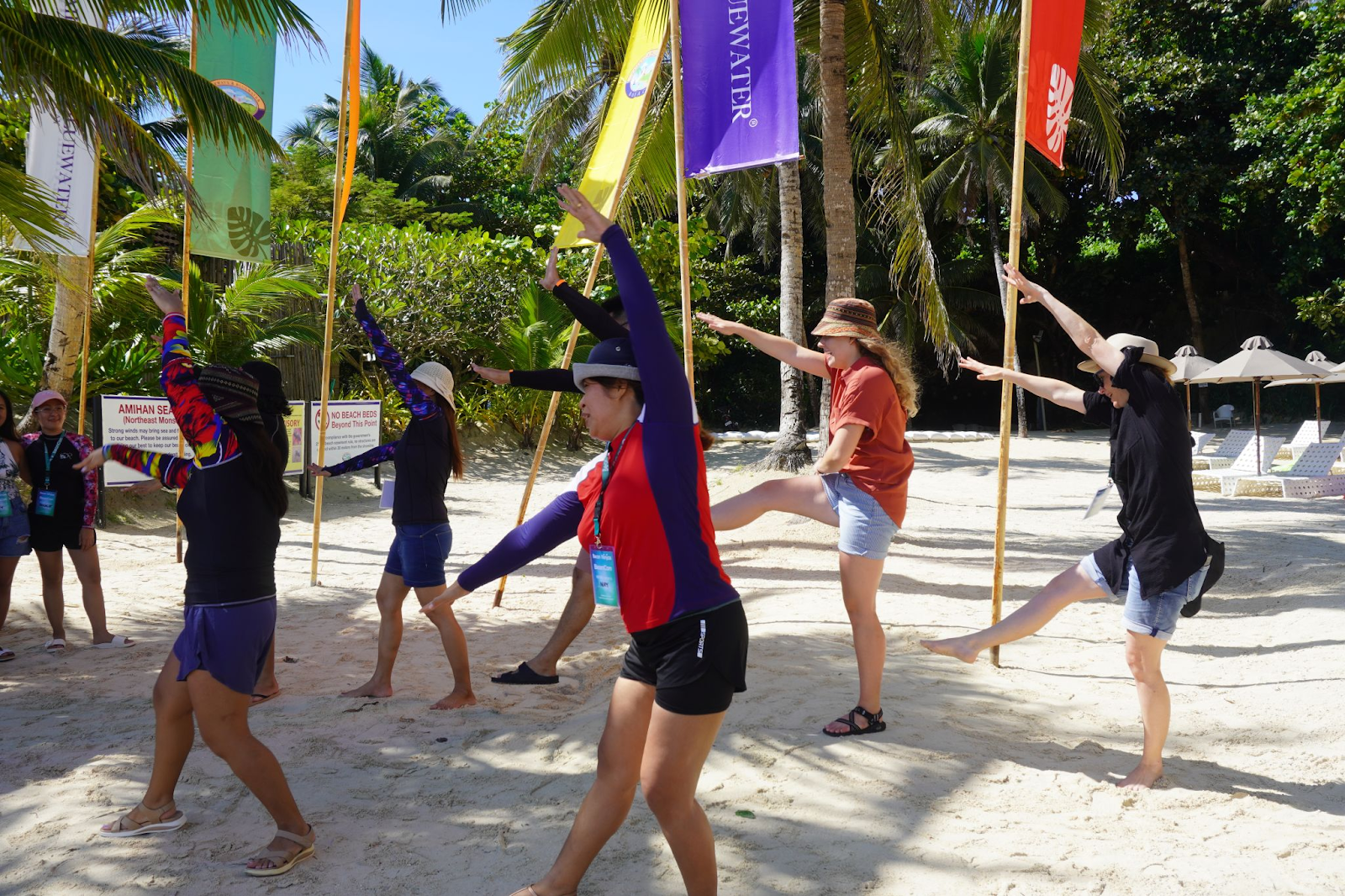 Team members exercising on the beach 