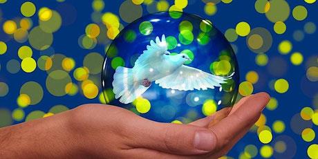 A hand holding a bubble with a white dove in it Description automatically generated