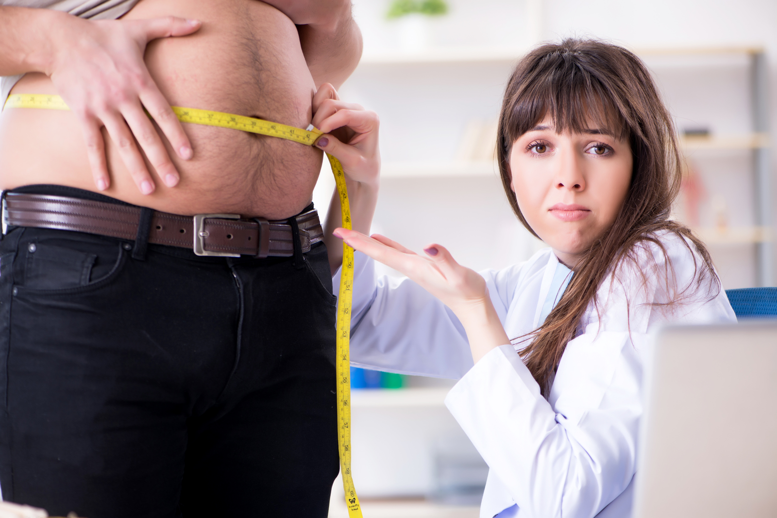 Man with huge belly consult with Doctor