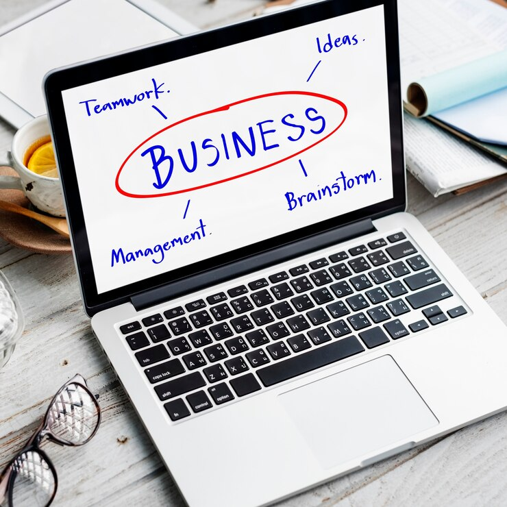A laptop showcasing business-related words, illustrating the dynamic of Business Management.