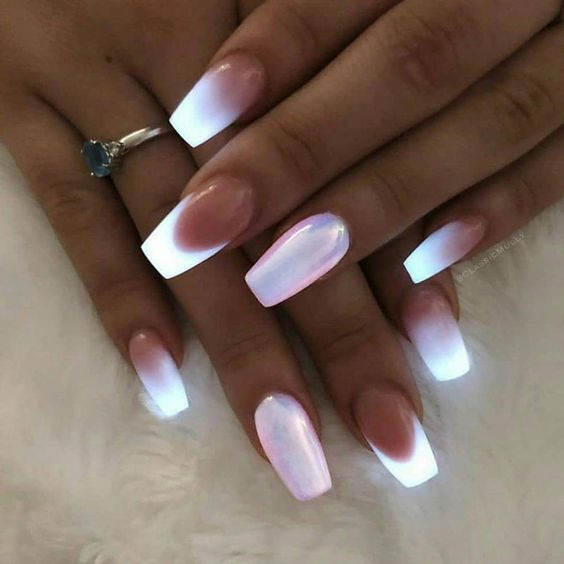 Picture showing a lady wearing a  glowing solar nails