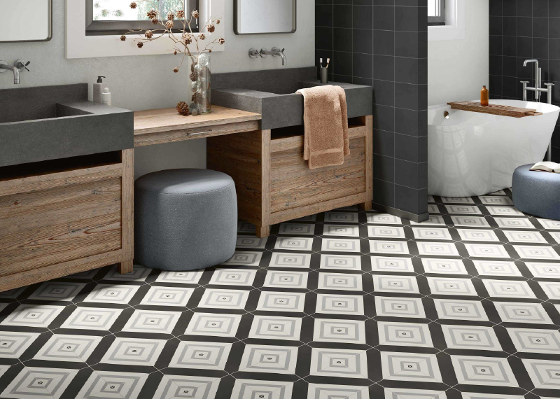 A bathroom with a black and white floor

Description automatically generated