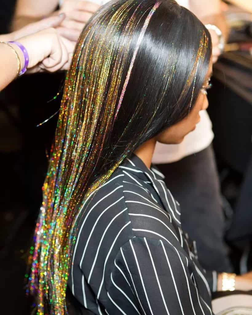 Side view of a lady rocking the shimmering hair look
