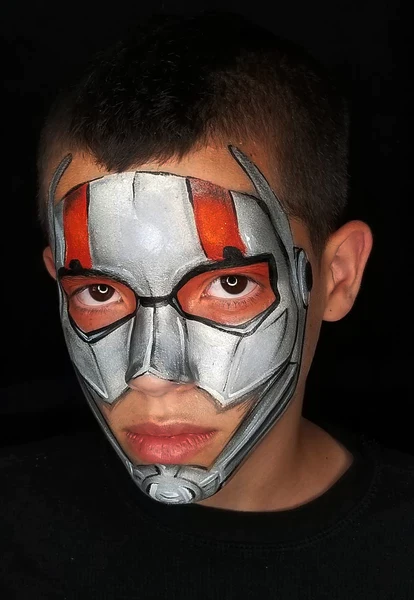 Picture of a boy rocking the ant man face paint design