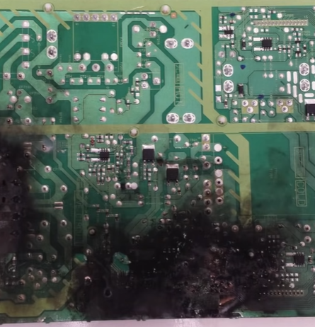 Burn marks below the main board.