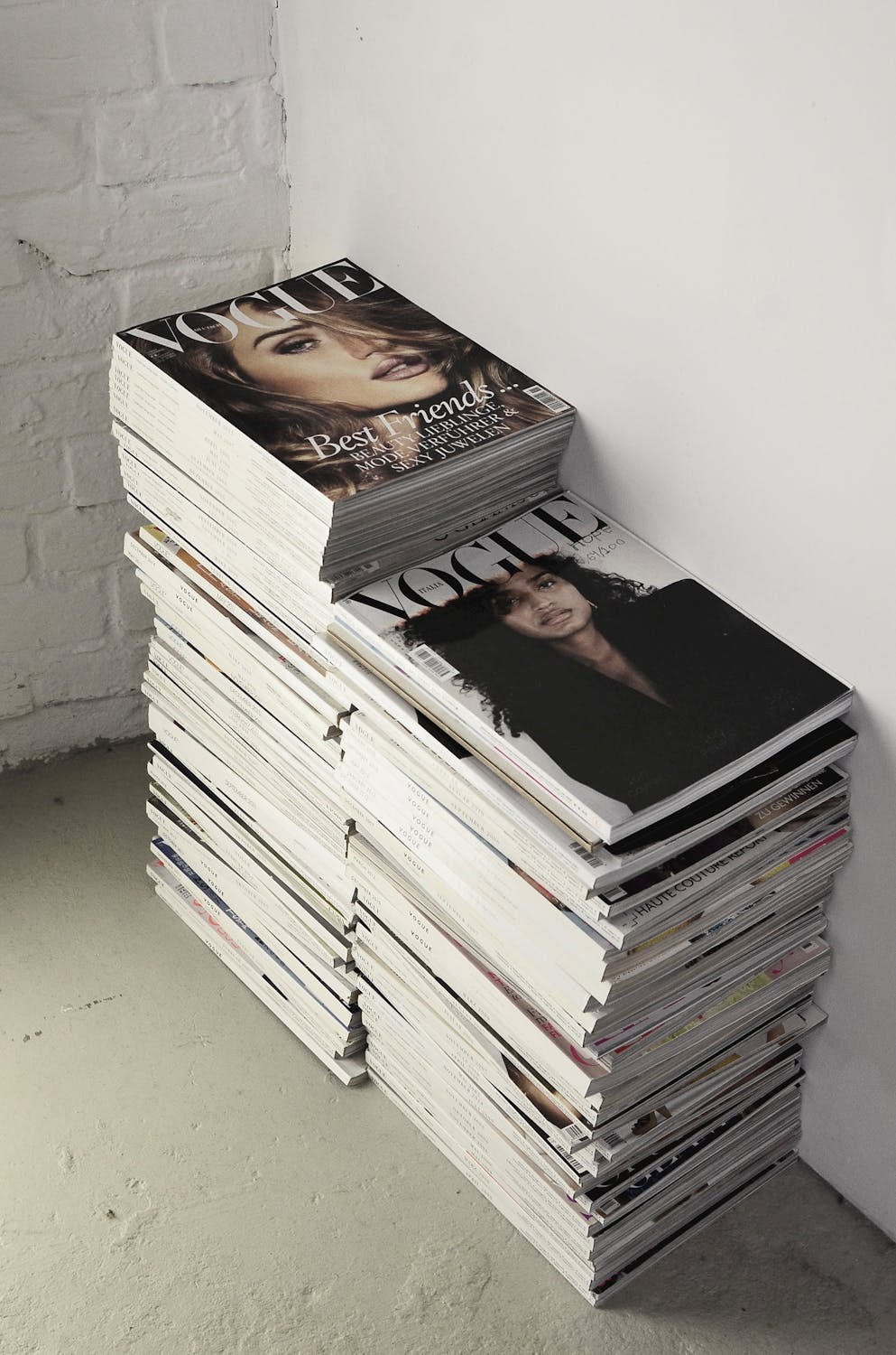 Stacks of Vogue magazines