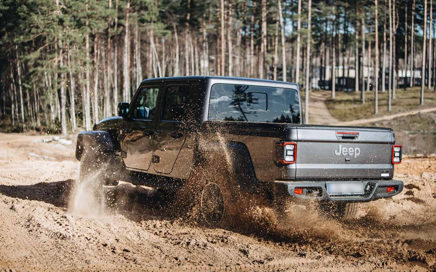 Jeep Gladiator going up a terrain 