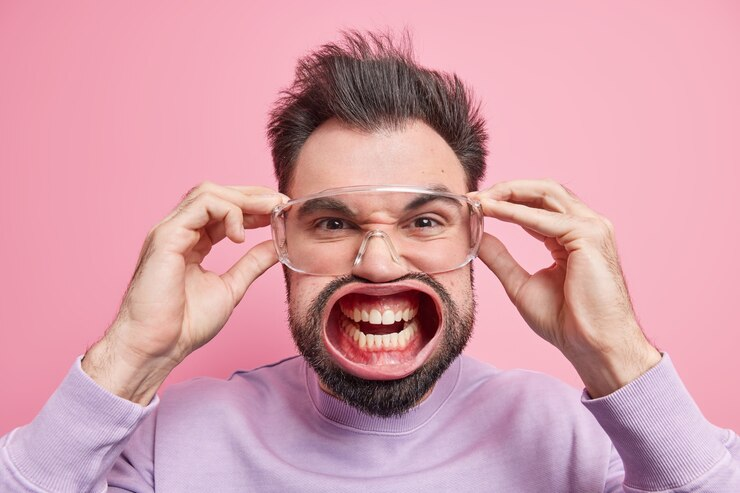 a man in goggles and very wide mouth