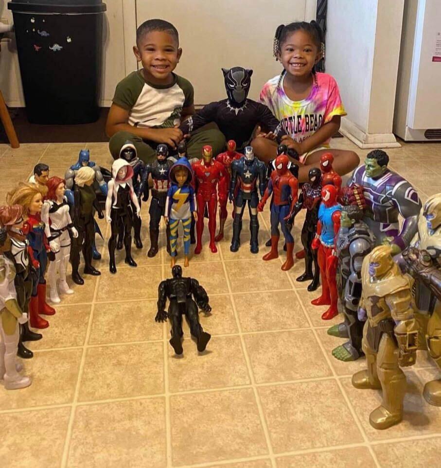 A group of children posing with action figures

Description automatically generated with low confidence