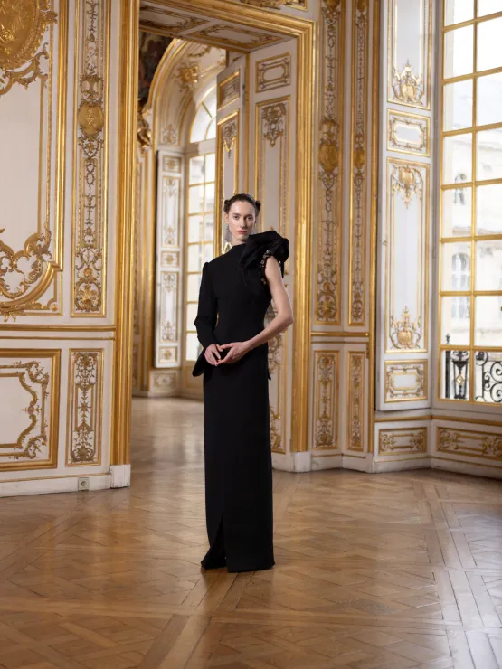 Picture of a model rocking PEET DULLAERT stunning black gown  on the runway