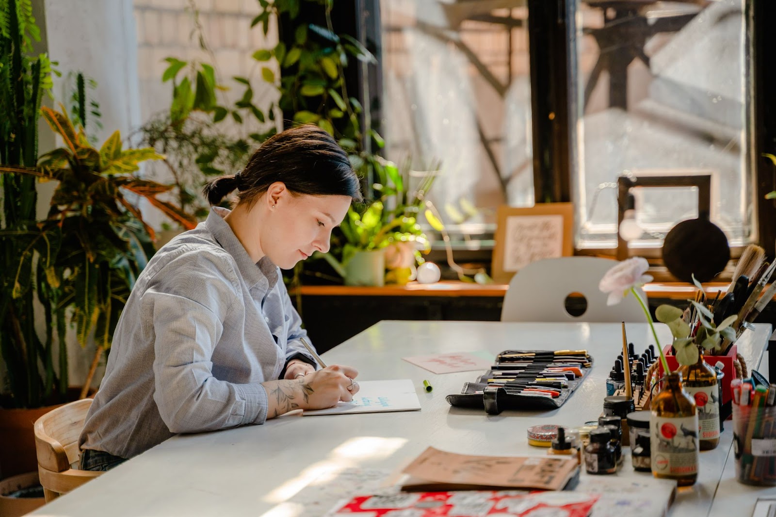 image of illustrator sitting at her desk
