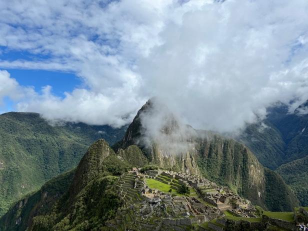 A mountain with a stone structure on it

Description automatically generated with medium confidence