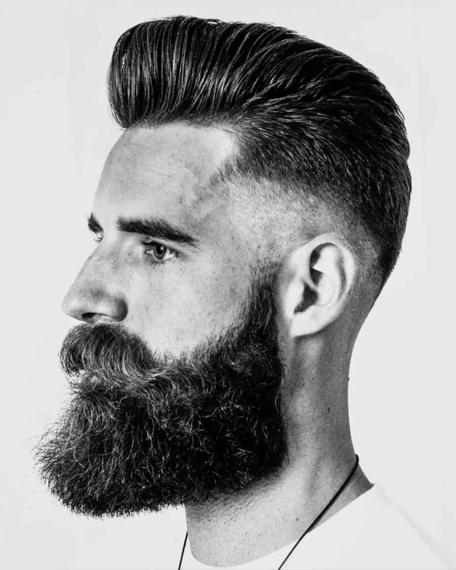 Picture showing a guy rocking the pompadour with the drop fade