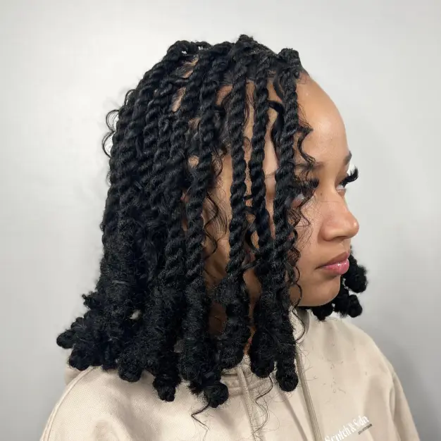 Picture showing a lady rocking dreadlocks with loose spirals