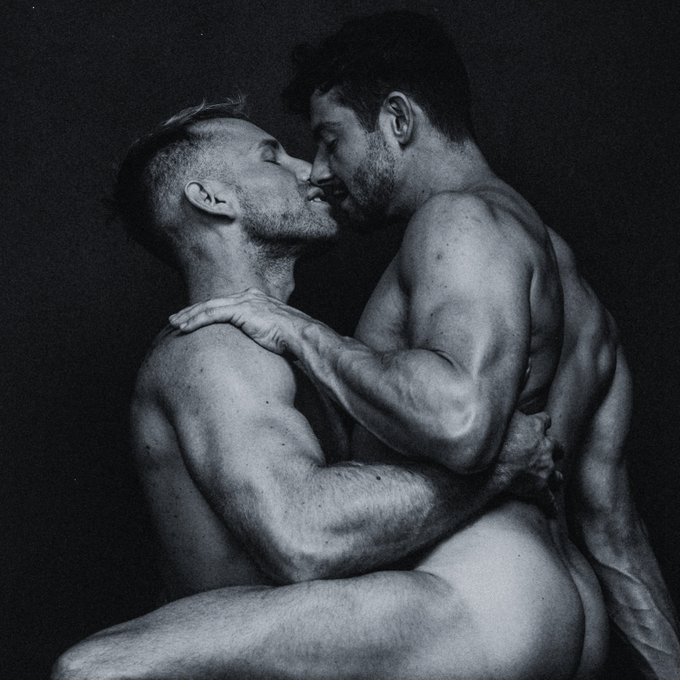 Koaty and Sumner Blayne kissing naked in a black and white photo