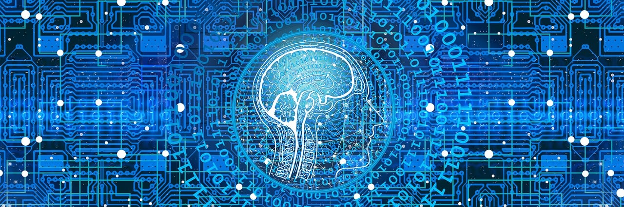 A digital image of a human brain integrated within a blue circuit board pattern.