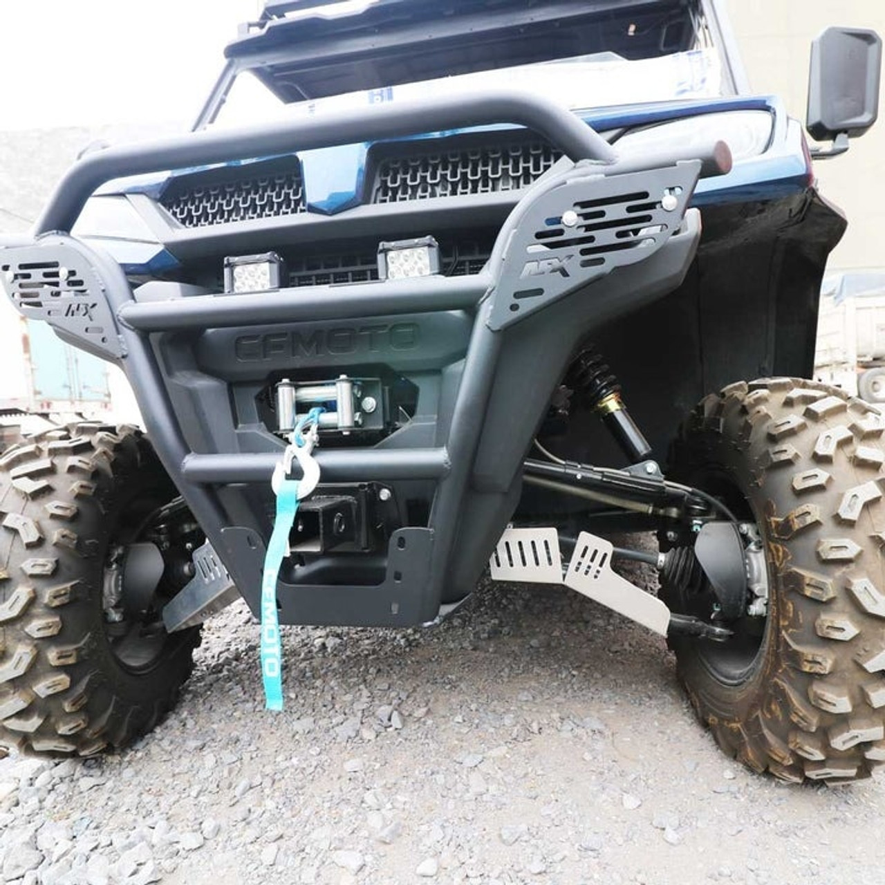 A front-facing picture of a CFMoto UTV parked on gravel with CFMoto UForce 1000 A-Arm Guards by AFX Motorsports installed.