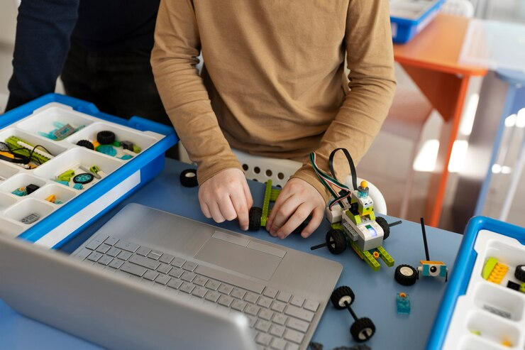 Child assembling robot with electronic parts.