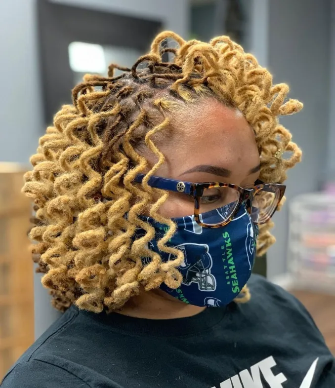 Picture showing a lady rocking spiral wavy locs