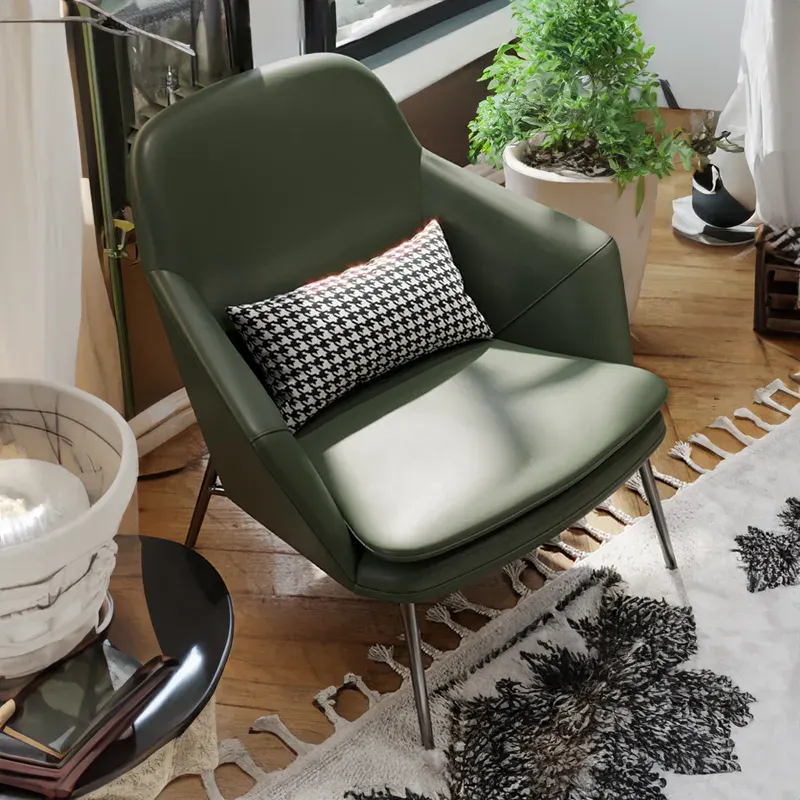 Green accent chair with arm rests and steel legs
