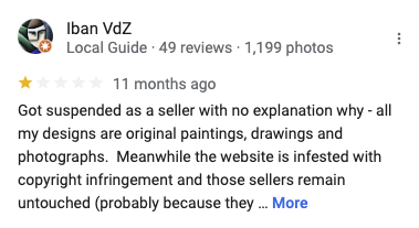 A negative Redbubble review from someone whose seller account was suspended. 